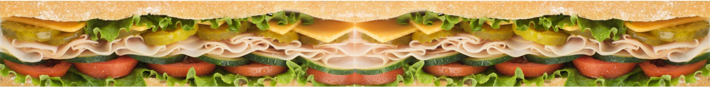 Fresh Jersey Mike's Subs sandwich half showing lettuce, tomato, cucumber, ham, cheese and pickles