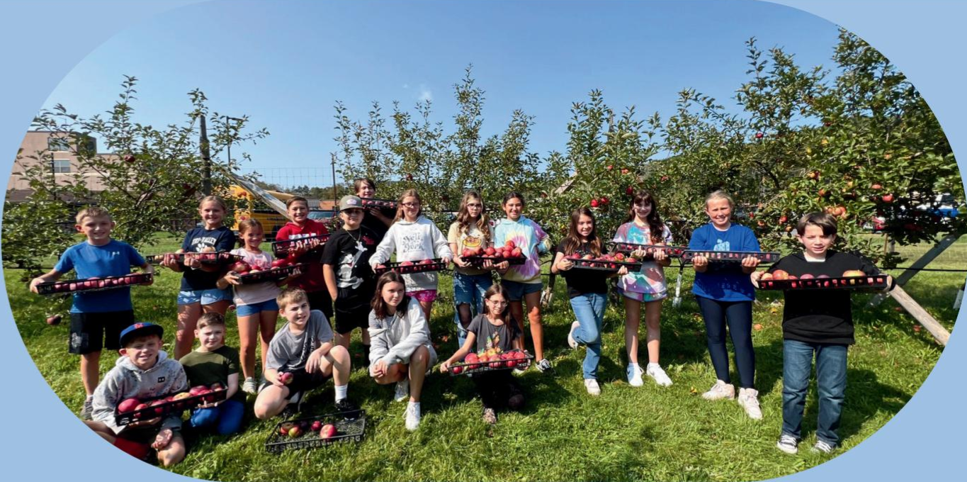 Elementary school children at apple orchard