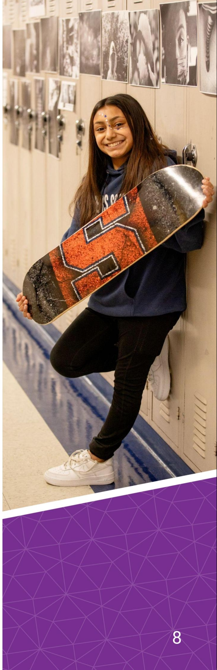 DPS student holding skateboard